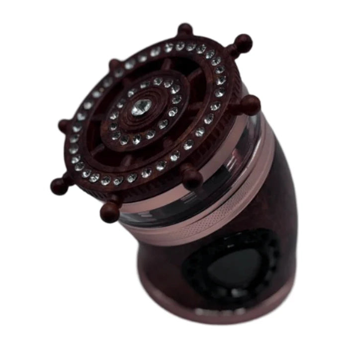  metal grinder showing the central chamber with multiple holes and sharp grinding teeth.