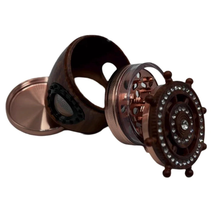 Top view of a metal grinder showing the central chamber with multiple holes