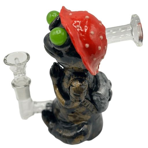 Handmade clay water pipe featuring a frog sitting on a red mushroom cap design